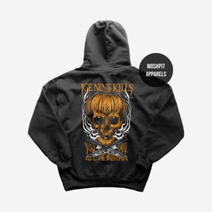 May include: Dark grey hoodie with a pumpkin skull design, the text "Ice Nine Kills" and "You Can't Kill The Boogeyman". The design includes crossed knives and smoke effects. The hoodie has a hood and a front pocket.