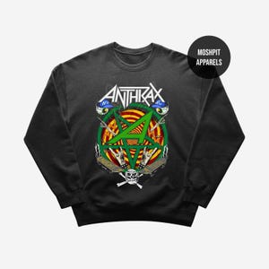 May include: Black Anthrax sweatshirt with a green pentagram design and the band's name in white. The graphic includes a skull, crossed bones, and the text "Caught in a Mosh". The sweatshirt has a crew neck.