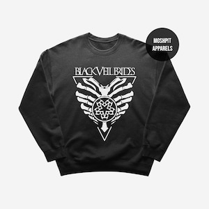 May include: Black crew neck sweatshirt with a white graphic. The graphic features the text "BLACK VEIL BRIDES" above a stylized design of a skeleton hand and a circular emblem. The sweatshirt has the text "MOSHPIT APPARELS" on a black circle.