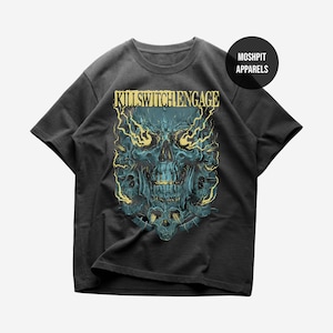 May include: Dark gray t-shirt featuring a teal skull design with yellow lightning bolts and the text "KILLSWITCHENGAGE". The shirt also has the text "MOSHPIT APPARELS" in a black circle.