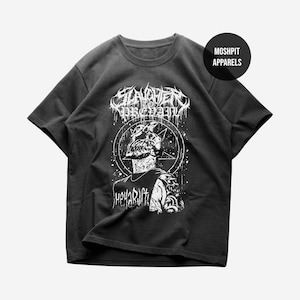 May include: Dark gray t-shirt featuring a white graphic of a figure with a pentagram and the text "Slaughter to Prevail" and "Hoya Drift". The shirt has a crew neck and short sleeves. The brand name "Moshpit Apparels" is also visible.