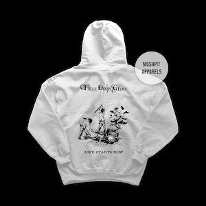May include: A white hooded sweatshirt with a black graphic design on the back. The design includes the text "Three Days Grace" above an illustration and the words "LIFE STARTS NOW" below it. The brand name "MOSHPIT APPARELS" is also visible.