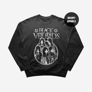 May include: Black crewneck sweatshirt featuring a white graphic of the band Black Veil Brides. The band members are depicted in a circular design with the band's name above them. The sweatshirt has a simple, classic design.