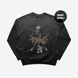 May include: A dark grey crew neck sweatshirt with a skull and crossed knives design. The word "Hate" is in gold lettering. A snake is also featured in the design. The brand name "Moshpit Apparels" is in a black circle.