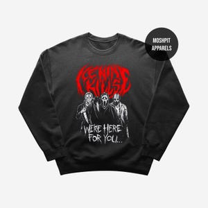 May include: Black crew neck sweatshirt with a graphic of three horror movie characters and the red text "FEAR IS KILLED". Below the characters is the white text "WE'RE HERE FOR YOU..."