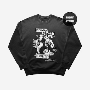 May include: Black crewneck sweatshirt with a graphic featuring the band Måneskin. The design includes the text "I Wanna Be Your Slave" and images of the band members in white. The brand name "Moshpit Apparels" is also visible.