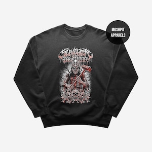 May include: Black crewneck sweatshirt with a graphic featuring a figure holding a hammer, surrounded by skulls. The text "Slaughter to Prevail" is above the figure in a red and white design. The brand name "Moshpit Apparels" is on the upper right.