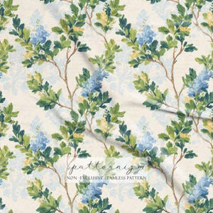 May include: A seamless pattern featuring watercolor illustrations of flowering branches with blue and yellow blossoms and green leaves. The branches are set against a cream background with a subtle damask design and script. The text "patternizm" and "NON-EXCLUSIVE SEAMLESS PATTERN" are visible.