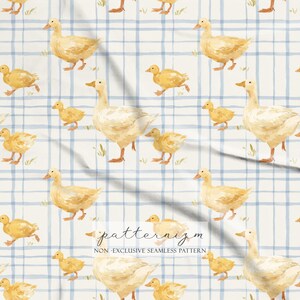 May include: Watercolor pattern featuring ducks and ducklings in shades of yellow and cream, set against a blue and white plaid background. The design includes the text "patternizm" and "NON-EXCLUSIVE SEAMLESS PATTERN".