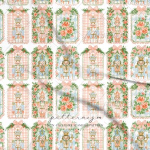 May include: A seamless pattern featuring repeating rectangular tags with scalloped edges. The design includes illustrations of nutcrackers in blue and pink uniforms, and bouquets of pink roses, all framed by green pine branches and pink bows.