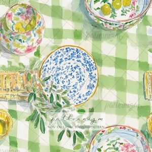 May include: Watercolor illustration of a table setting with plates, bowls, and a vase. The plates feature blue and white patterns, while the bowls display lemons and floral designs. The scene is set on a green and white checkered tablecloth, with the text "patternizm" visible.
