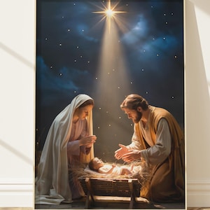 May include: A framed print depicting the Nativity scene. Mary and Joseph are kneeling beside the baby Jesus in a manger. A bright star shines down from a dark, starry sky. The artwork is set in a gold frame.