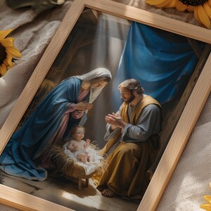 May include: A framed print of a religious scene featuring Mary, Joseph, and baby Jesus. The artwork is set in a wooden frame and surrounded by sunflowers on a neutral-colored cloth. The image has a warm, inviting aesthetic.