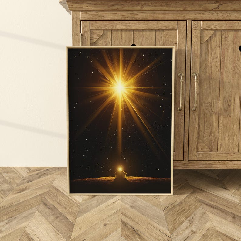 May include: A framed print featuring a bright golden starburst against a dark background with a small, illuminated structure below. The artwork has a celestial theme, with a warm, radiant glow emanating from the star.