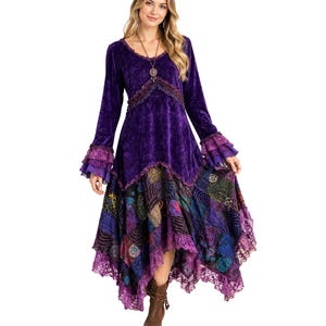 May include: A long-sleeved purple velvet dress featuring a scoop neckline, tiered ruffled cuffs, and a multi-patterned patchwork skirt with an asymmetrical hemline. The dress is accented with lace trim along the bodice and the bottom hem.