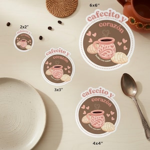 May include: A collection of stickers with a coffee theme. The stickers feature a pink mug with a floral design, a concha pastry, and the text "cafecito y corazón". Sizes range from 2x2 inches to 6x6 inches.