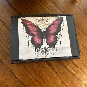 May include: A set of three ceramic mugs with a speckled, matte finish. The mugs are in shades of cream, light gray, and dark gray. Each mug has a simple, minimalist design, perfect for coffee or tea.