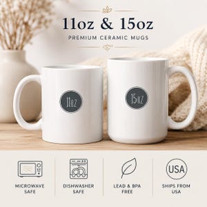 May include: Two white ceramic mugs, one 11oz and one 15oz, featuring circular labels indicating their respective sizes. Below the mugs, four icons indicate microwave safe, dishwasher safe, lead and BPA free, and ships from USA.