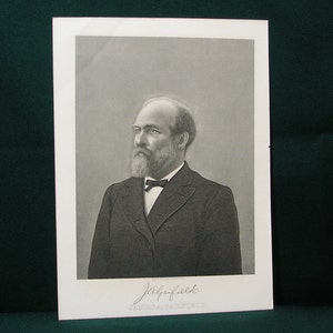 May include: Black and white portrait of a man with a beard and mustache, wearing a suit and tie. The image is a print with the signature "Jaques Field" at the bottom.