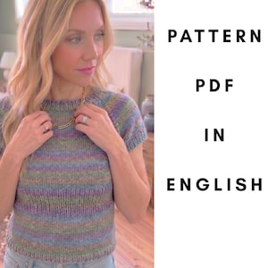 May include: A short-sleeved, multi-colored knit top with horizontal stripes in shades of blue, green, purple, and tan. The text "PATTERN PDF IN ENGLISH" is displayed in black, vertically on the right side of the image.