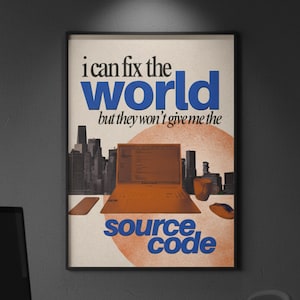 May include: A framed poster with the text "i can fix the world but they won't give me the source code." The image features a stylized orange laptop, mouse, and cityscape silhouette. The poster has a retro design with a tech studio logo.