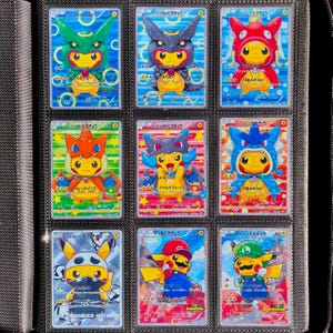 May include: Nine collectible trading cards featuring Pikachu in various costumes and designs. The cards are displayed in a binder, showcasing a variety of colours and character themes. Each card has Japanese text and a Pikachu graphic.