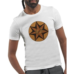 May include: White t-shirt featuring a circular design with a star-like pattern. The design is in shades of brown and orange, with a striped and spiral center. The shirt is short-sleeved and appears to be made of cotton.
