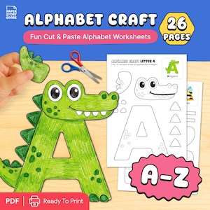May include: A green alligator-shaped letter "A" from an alphabet craft kit. The image includes a cut-out piece, scissors, and a worksheet with the letter "A" and an alligator illustration. The kit is labeled "Alphabet Craft" and "Fun Cut & Paste Alphabet Worksheets."