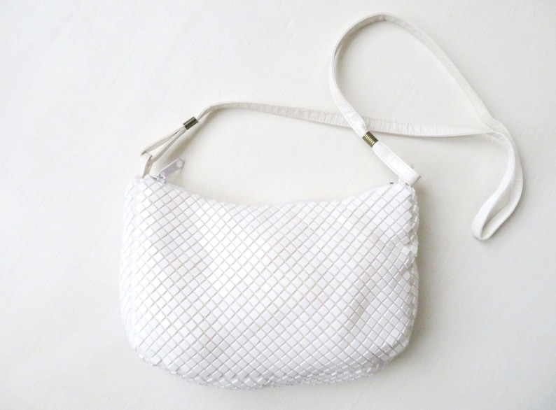 Vintage 70's 80's white plastic beaded tile bag with faux leather long shoulder strap. Soft, unstructured shape, top zipper opening & inside zippered pocket with fabric lining.