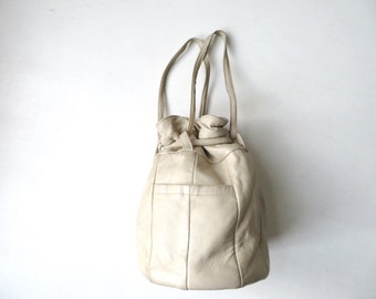 drawstring bag, small beige leather bucket bag, round shape, vintage 60s, handcrafted handbag, creasing & slightly soiled