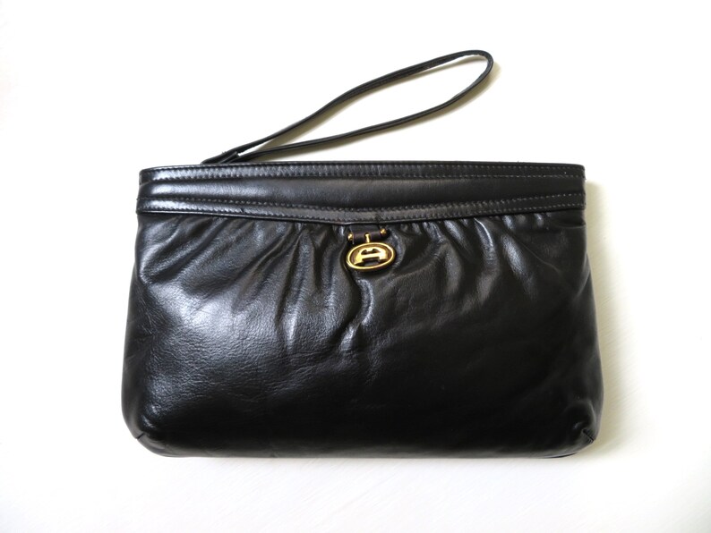 leather clutch bag with wrist strap