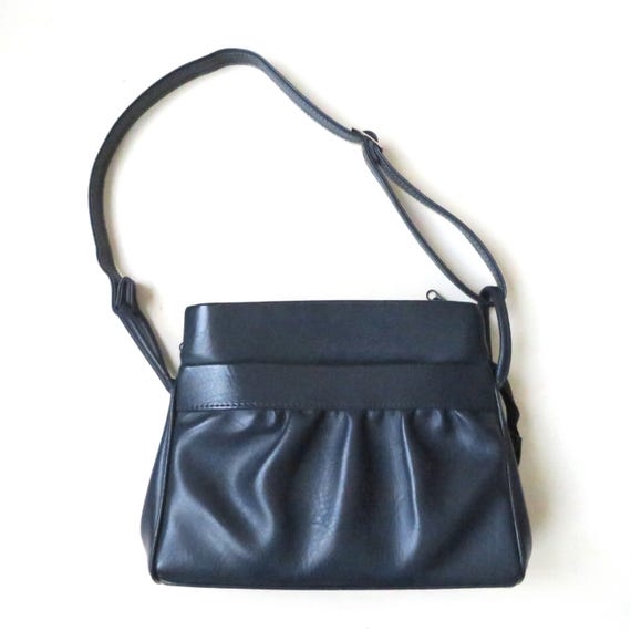vintage navy blue shoulder bag with long strap, minimalist style, 1970s vegan purse