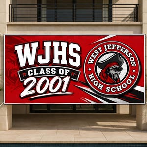 May include: A large red banner with white text that reads "WJHS CLASS OF 2001". The banner also features a circular logo with a pirate and the words "WEST JEFFERSON HIGH SCHOOL". The banner is displayed outdoors.