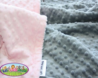 May include: Two fabric swatches, one pink and one gray, with a textured, bumpy surface. The swatches are labeled "Lil' Cub Hub".