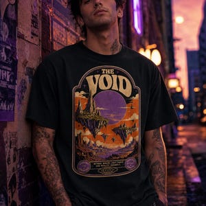 May include: A black short-sleeve t-shirt featuring a graphic print of floating islands under a large purple moon. The design includes the text THE VOID at the top and the phrase BEYOND WHERE LIGHT FADES AND REALITY UNRAVELS at the bottom.