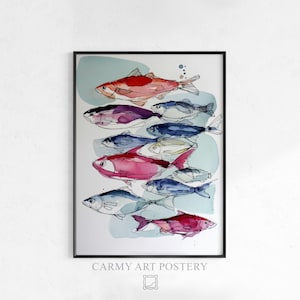 May include: A framed art print showing a shoal of fish in various colours. The fish are in shades of red, pink, blue, and purple, with black outlines. The artwork is set against a light blue background. The text "CARMY ART POSTERY" is at the bottom.