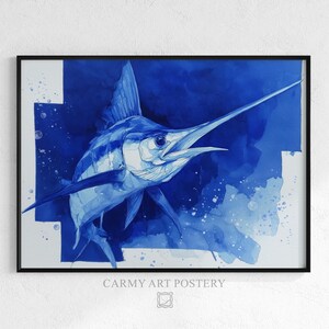 May include: A framed watercolor print of a blue marlin fish. The artwork features shades of blue, with the fish in the center and a dark blue background. The print is in a black frame and is labeled "CARMY ART POSTERY".