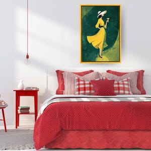 May include: A framed art print featuring a woman in a yellow dress holding a cocktail. The artwork has a green and yellow color scheme and is displayed above a bed with red bedding and pillows. The frame is gold.