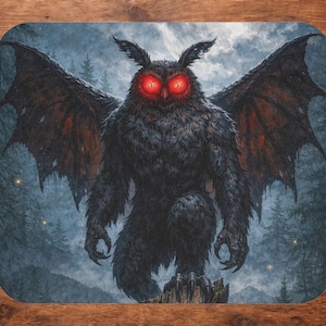 May include: A mousepad featuring a dark, ominous illustration of a Mothman-like creature with glowing red eyes and large wings. The creature stands in a forest setting with a dark, moody color palette.