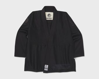 Kimono da jiu-jitsu Shoyoroll Lithos Competitor nero con borsa, ideale per grappling.