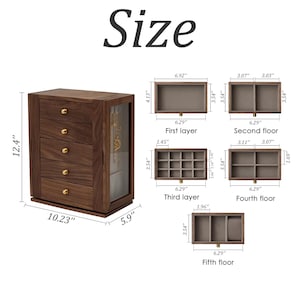 May include: A wooden jewellery box with five drawers and a glass-door compartment. The box is 31.5 cm tall, 26 cm wide, and 15 cm deep. The drawers have different compartment layouts. The word "Size" is at the top.