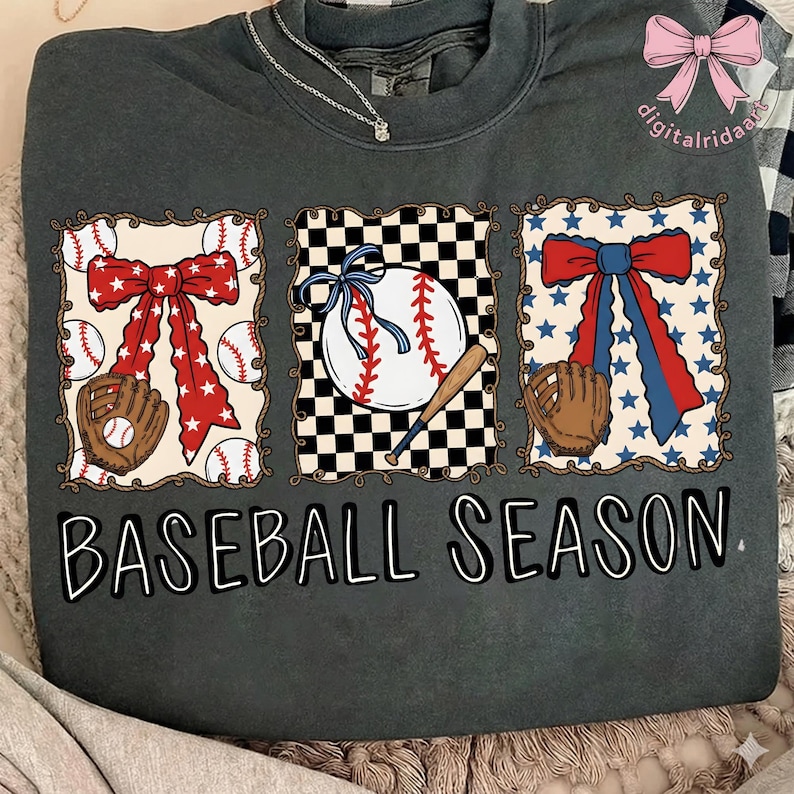 May include: Dark gray sweatshirt with a baseball-themed design. The design includes three framed images of baseballs, bows, and gloves. The text "BASEBALL SEASON" is printed in white below the images.