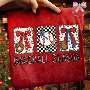 May include: Red baseball-themed pillow with three square designs. Each design features a baseball, glove, and bow. The text "BASEBALL SEASON" is printed in white across the bottom of the pillow.