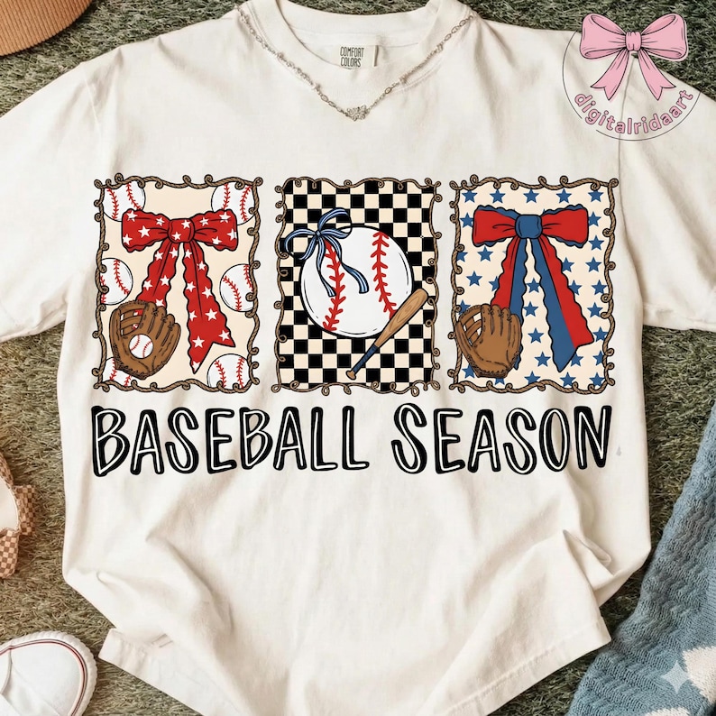 May include: White t-shirt with a baseball theme. The shirt features three rectangular designs with baseball elements: a baseball glove, baseballs, and bows. The text "BASEBALL SEASON" is printed in large, black letters across the bottom.
