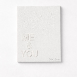 May include: A rectangular white canvas featuring the embossed text ME & YOU in a clean sans-serif font. The surface has a subtle textured finish, and the bottom right corner displays the printed dimensions of 20x25 cm for this wall art piece.