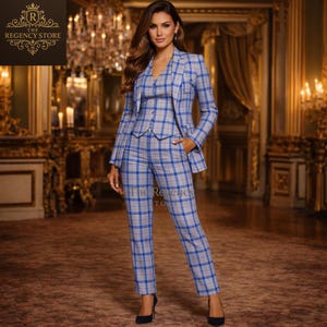 May include: A three-piece plaid suit in gray and blue. The suit includes a blazer, vest, and trousers. The Regency Store logo is visible in the upper left corner. The suit is worn with black heels.