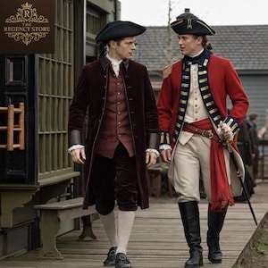 May include: Two men in historical attire walk outdoors. One wears a burgundy velvet coat, vest, and breeches, with a black tricorn hat. The other is in a red coat with gold trim, white breeches, and black boots, also wearing a tricorn hat. The Regency Store logo is in the top left.