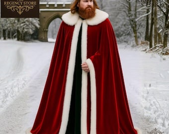May include: A red velvet cloak with white faux fur trim. The cloak is worn with a gold crown. The Regency Store logo is in the upper left corner. The background is a snowy forest.