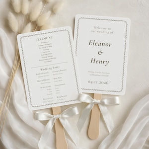 May include: A white ceramic mug with a black handle and the text "But First, Coffee" in a black, bold font. The mug is sitting on a wooden surface. The mug is approximately 4 inches tall.