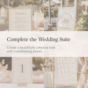 May include: A collection of wedding stationery including a bar menu, a welcome sign, a table number card, and a seating chart. Each piece features a cream background, dark text, and a decorative border. The text includes The Bar, Welcome to Our Wedding, Eanor & Henry, and Table No. 1.